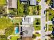 Aerial view showing the property, backyard with patio, neighboring houses, and street at 515 Clayton St, Orlando, FL 32804