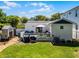 Backyard featuring spacious deck with outdoor seating, barbecue, shed, and well-maintained lawn at 515 Clayton St, Orlando, FL 32804