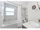 Well-lit bathroom with shower-tub combination, marble counter top, and stylish vanity at 515 Clayton St, Orlando, FL 32804