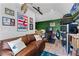 Eclectic living room with leather couch, mounted deer head, and a variety of wall decor at 515 Clayton St, Orlando, FL 32804