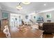 Open-concept living and dining area with hardwood floors, recessed lighting, and a comfortable seating area at 515 Clayton St, Orlando, FL 32804