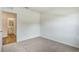 Well-lit, carpeted bedroom featuring an open door and view to adjoining bathroom at 5203 Marshelder St, Apopka, FL 32712