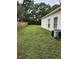 Expansive backyard featuring a lush green lawn and privacy fence at 5342 Rabbit Ridge Trl, Orlando, FL 32818