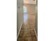 Hallway with neutral paint color and tile flooring that lead to the living area at 5342 Rabbit Ridge Trl, Orlando, FL 32818