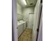 Laundry room equipped with a washer, dryer, and wire shelving at 5342 Rabbit Ridge Trl, Orlando, FL 32818