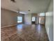 Spacious living room with tile flooring, ceiling fan, and plenty of natural light from the windows at 5342 Rabbit Ridge Trl, Orlando, FL 32818