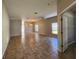 Open-concept living area with tile flooring, ceiling fan, and abundant natural light from many windows at 5342 Rabbit Ridge Trl, Orlando, FL 32818
