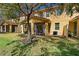 Large backyard with lush grass, trees, and views of the screened-in patio at 5373 Via Appia Way, Sanford, FL 32771