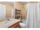 Bright bathroom features a vanity with sink, tiled shower/tub, and neutral walls at 5373 Via Appia Way, Sanford, FL 32771