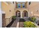Inviting front courtyard with wrought iron gate and dual entrances at 5373 Via Appia Way, Sanford, FL 32771