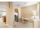 Hallway with tile floor, white trim, and view of the kitchen at 5373 Via Appia Way, Sanford, FL 32771