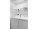 Bright laundry room with modern washer and dryer units, and shelving at 5373 Via Appia Way, Sanford, FL 32771
