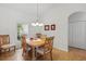 Traditional dining room boasts a decorative light fixture and seating for six at 548 Burford Cir, Davenport, FL 33896