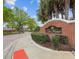 Welcoming brick entrance sign with manicured landscaping, marking the entry to 'The Manor' community at 548 Burford Cir, Davenport, FL 33896