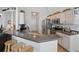 Bright eat-in kitchen with stainless appliances, granite counters, and breakfast bar at 548 Burford Cir, Davenport, FL 33896