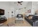 Open-concept living room with tile floors, neutral decor, and plenty of space for entertaining at 548 Burford Cir, Davenport, FL 33896