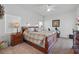 Spacious main bedroom with a ceiling fan and a window at 548 Burford Cir, Davenport, FL 33896