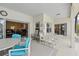 Covered patio with multiple seating areas and open access into the home at 548 Burford Cir, Davenport, FL 33896
