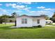 Charming one-story home with a well-maintained lawn and cozy screened-in patio at 5900 Lyle St, Orlando, FL 32807