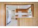 Open kitchen with wood cabinets, ample counter space, and convenient breakfast bar at 5900 Lyle St, Orlando, FL 32807