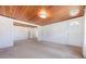 A bright living room with hardwood ceiling, fresh carpet, and an open floor plan at 5900 Lyle St, Orlando, FL 32807