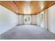 Spacious living room boasts a hardwood ceiling, new carpet, and great natural lighting at 5900 Lyle St, Orlando, FL 32807