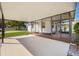 Spacious covered patio and adjacent screened-in porch create an inviting outdoor living space with easy access to backyard at 5900 Lyle St, Orlando, FL 32807