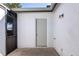 Enclosed patio with a door to the exterior, a screen door, and an exterior light fixture at 5971 Parkview Point Dr, Orlando, FL 32821