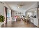 Spacious living room featuring sleek wood floors, contemporary decor, and natural light at 611 Saddle Ridge Dr, Davenport, FL 33896