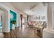 Bright living room featuring sleek wood floors, contemporary decor, and sliding glass doors to outdoor area at 611 Saddle Ridge Dr, Davenport, FL 33896