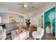 Open concept living room with modern decor, sleek flooring, and ample natural light at 611 Saddle Ridge Dr, Davenport, FL 33896
