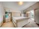 Bright bedroom with a tufted headboard and access to the pool at 611 Saddle Ridge Dr, Davenport, FL 33896