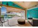 Screened pool area with outdoor furniture and festive decor at 611 Saddle Ridge Dr, Davenport, FL 33896