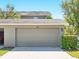 Attached two-car garage providing convenient parking and extra storage space at 7776 Rigby St, Windermere, FL 34786