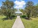 Scenic gazebo surrounded by lush greenery, providing a serene outdoor retreat at 7776 Rigby St, Windermere, FL 34786