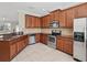 Spacious kitchen includes stainless steel appliances, granite countertops, and ample cabinet space at 7776 Rigby St, Windermere, FL 34786