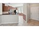 Open-concept kitchen with stainless steel appliances, granite countertops, and views to the dining area at 7776 Rigby St, Windermere, FL 34786