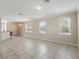 Expansive living area with tiled floors, ample natural light, and open layout at 7776 Rigby St, Windermere, FL 34786