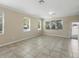 Large, naturally lit living room with tile floors at 7776 Rigby St, Windermere, FL 34786