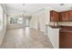 Open-concept living space featuring tile flooring and ample natural light at 7776 Rigby St, Windermere, FL 34786