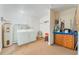 Functional laundry room with washer, dryer, and additional storage space at 913 Jacaranda Dr, Lady Lake, FL 32159