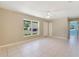 Open floor plan with tiled floor, ceiling fan, and natural light coming through the window at 913 Jacaranda Dr, Lady Lake, FL 32159