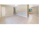 Spacious living area with tile flooring, ceiling fans, and neutral paint at 913 Jacaranda Dr, Lady Lake, FL 32159