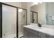 Modern bathroom with walk-in shower, updated vanity, and stylish fixtures at 942 Jack Nicklaus Ct, Kissimmee, FL 34747
