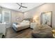 Cozy bedroom with a gray bed, bedside tables, and a comfortable beanbag chair at 942 Jack Nicklaus Ct, Kissimmee, FL 34747