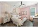 Pink bedroom featuring a white bed with decorative pillows and ballerina-themed wallpaper at 942 Jack Nicklaus Ct, Kissimmee, FL 34747
