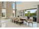 Grand dining room boasting soaring ceilings, abundant natural light, and serene outdoor views at 942 Jack Nicklaus Ct, Kissimmee, FL 34747