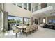 Sophisticated dining room featuring tall ceilings, pool views, and seamless indoor-outdoor flow at 942 Jack Nicklaus Ct, Kissimmee, FL 34747