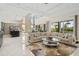 Bright, open-concept living room boasting high ceilings, stylish decor, and marble floors at 942 Jack Nicklaus Ct, Kissimmee, FL 34747