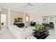 Stylish living room featuring modern decor, recessed lighting, and a neutral color palette at 942 Jack Nicklaus Ct, Kissimmee, FL 34747
